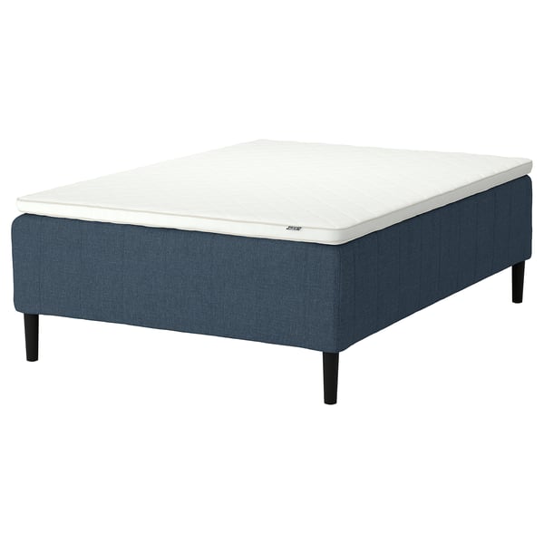 Blue upholstered RISHÖJDEN bed with black legs, white mattress, pocket springs, reinforced edge.