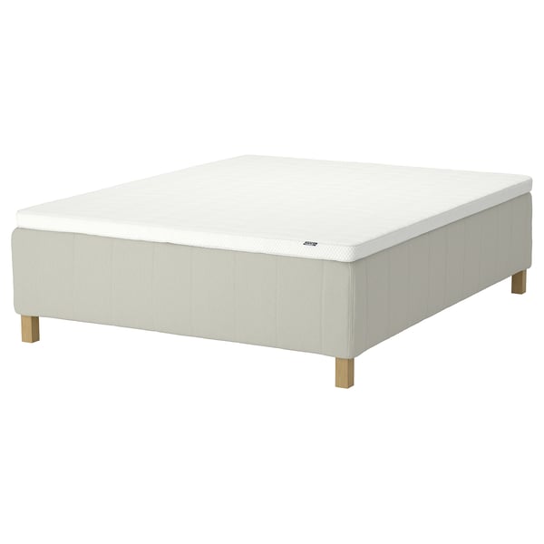 RISHÖJDEN mattress, light beige, upholstered with rectangular design, supported by wooden legs.