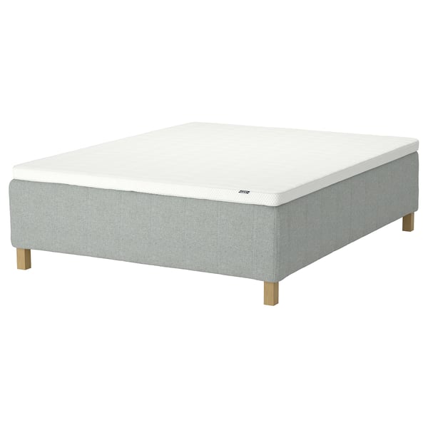 The RISHÖJDEN mattress: white top, grey base, 4 wooden legs, foam comfort, grey fabric side, supportive.