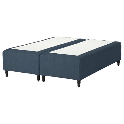 A RISHÖJDEN blue bed base with white mattress, featuring 7 comfort zones and dark wooden legs.