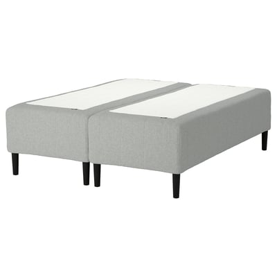 A grey RISHÖJDEN adjustable bed base with white mattresses, featuring a minimalist design and sturdy wooden legs.