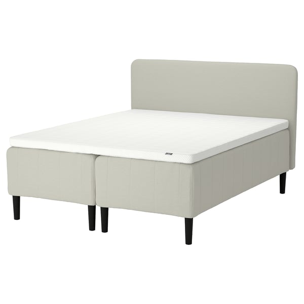 RISHÖJDEN bed: light grey, upholstered with wooden legs, square tufted design.