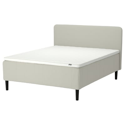 RISHÖJDEN bed, beige, upholstered, clean lines, white mattress, padded headboard.