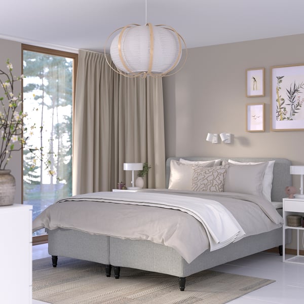 Modern bedroom: gray bed, pendant light, beige curtains