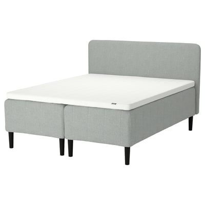 Modern grey fabric upholstered bed frame with light grey mattress. A soft headboard and black wooden legs.