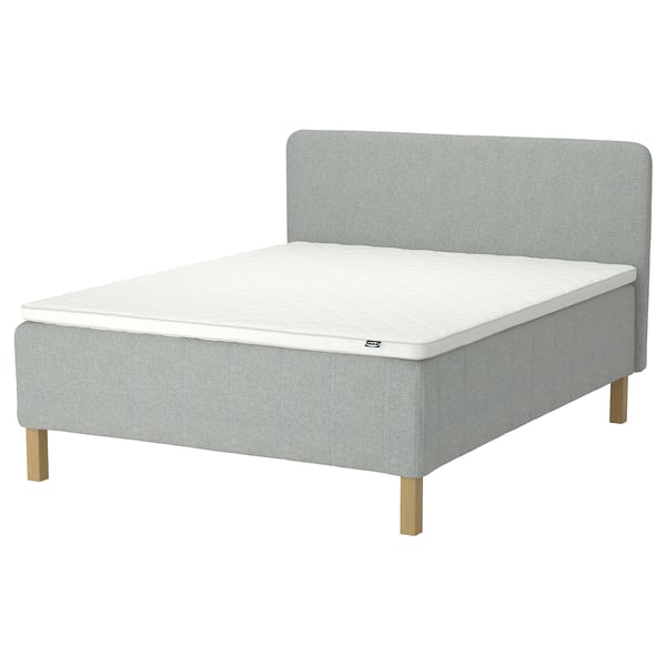Modern bed: light grey, upholstered, wooden legs, headboard, mattress.