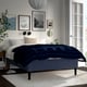 Modern bedroom with RISHÖJDEN bed, blue blanket, white pillows, dark floor, art, lantern, mirror, plant.