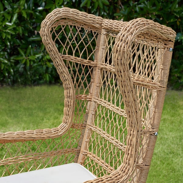 Wicker chair with intricate weaving, high back. Comfortable, weather-resistant, durable outdoor seating.