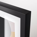 A sleek black picture frame with modern design, showcasing a colorful abstract artwork.