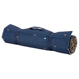 Blue rolled-up mat with handles, gold dots pattern, recycled materials. Perfect for kids play and travel.