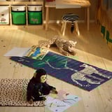 Blue savannah play mat with monkey and zebra toys, kid-friendly.