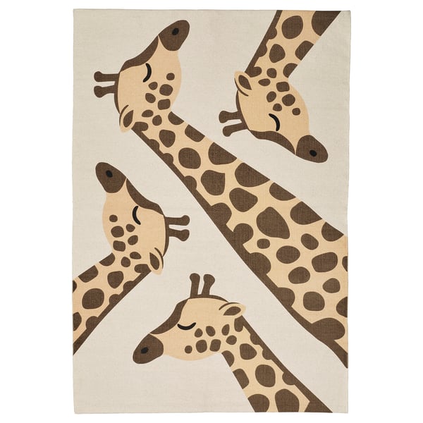 A SANDLÖPARE rug, featuring playful giraffe designs in brown and beige on a light background, made of recycled cotton.