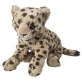 Stuffed snow leopard toy with beige and dark spots, sitting, soft white background.