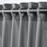Curtains with tab top headers for easy hanging. Pockets catch rod for support.