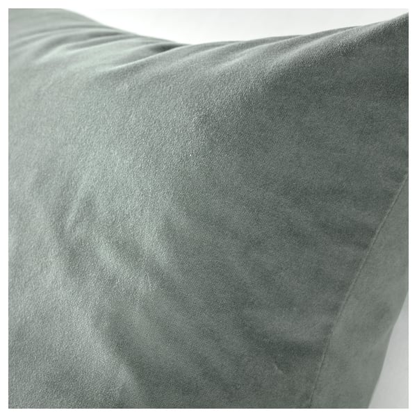 Soft grey-green cotton velvet cushion, close-up, displaying luxurious texture.