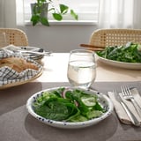 Table set with SILVERSIDA dishware: salad bowl, glass, bread basket, and cutlery.