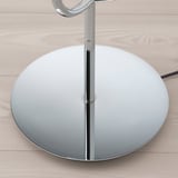 Modern, sleek lamp with chrome base and glass shade reflecting quality and elegance.