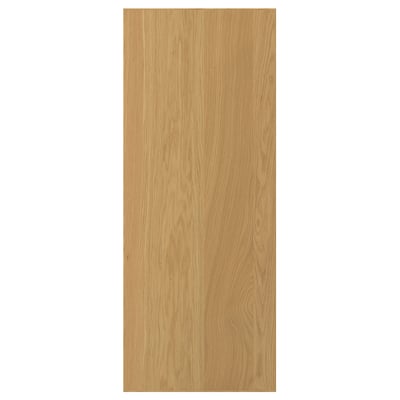 A light wooden door named SINARP. Its made of oak veneer and a solid wood edge. The door is rectangular and has a natural wood grain design.