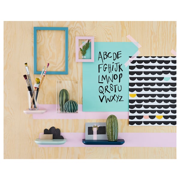 Wooden wall shelf with blue frame, cacti decorations, colorful notes, and pink holders.