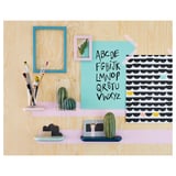 Wooden wall shelf with blue frame, cacti decorations, colorful notes, and pink holders.
