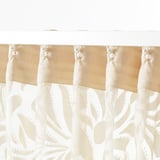 Sheer curtains with a floral pattern. They filter light and offer privacy, ideal for layered window solutions. The top hooks for easy hanging.