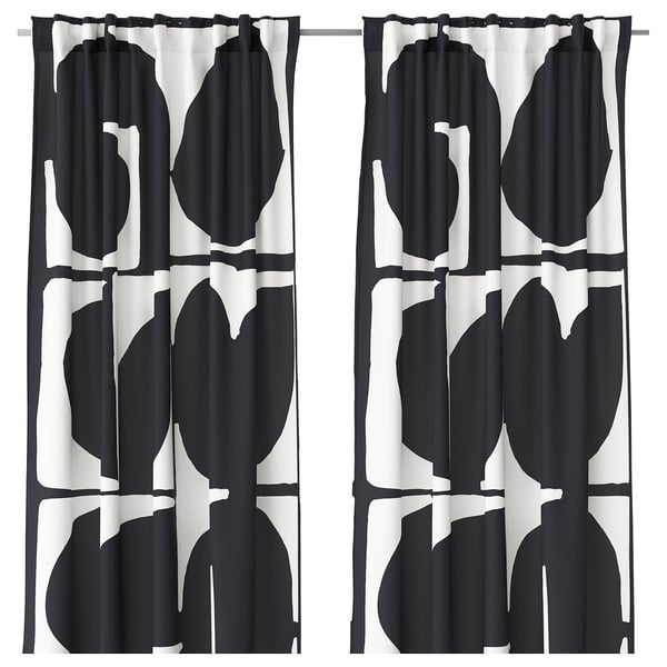 Black and white leaf-patterned curtains with black edging.