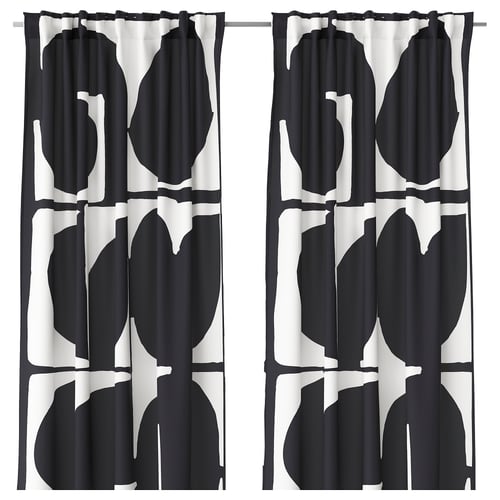 Black and white leaf-patterned curtains with black edging.