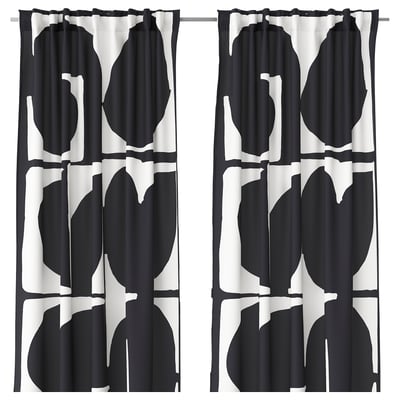 Black and white leaf-patterned curtains with black edging.
