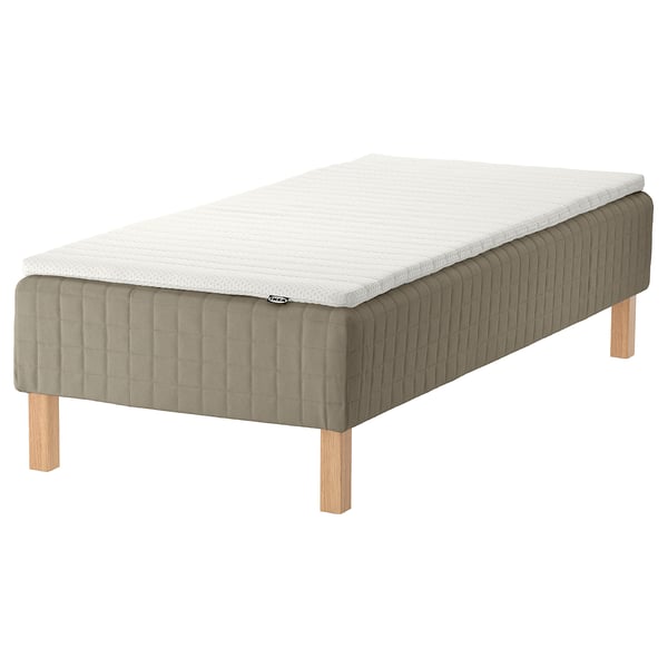 IKEA SKÅRER bed: rectangular, olive-green, upholstered wooden base with light-brown legs, white foam mattress.