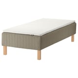 IKEA SKÅRER bed: rectangular, olive-green, upholstered wooden base with light-brown legs, white foam mattress.
