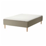 An SKÅRER bed with a white mattress on a beige, wooden base. The base has visible legs and a simple design.