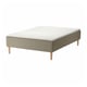 An SKÅRER bed with a white mattress on a beige, wooden base. The base has visible legs and a simple design.