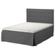 A modern gray bed with a tufted headboard and white mattress.