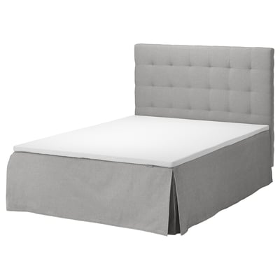 The SKOTTERUD bed a gray, upholstered tufted headboard and matching valance, creating a modern and elegant look.