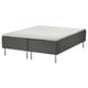SKOTTERUD bed in white and dark grey, with quilted pattern, sitting on metallic legs.