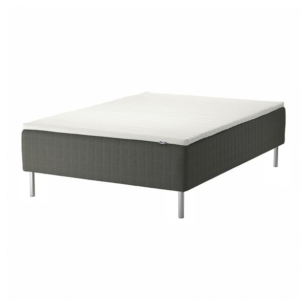 SKOTTERUD bed in white and dark gray, rectangular shape, with metal legs, quilted design.