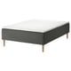 A SKOTTERUD gray mattress on a wooden base with light wood legs. It has a rectangular shape and a textured surface with a white top.
