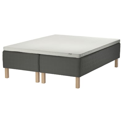 Image displays a SKOTTERUD bed base with light gray mattress; includes wooden legs, supportive bonnell springs, and plush foam for comfort.