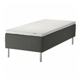 SKOTTERUD bed in white & dark grey, quilted, raised on metal legs.