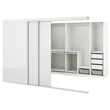 A white SKYTTA wardrobe with mirrored sliding doors and storage shelves.