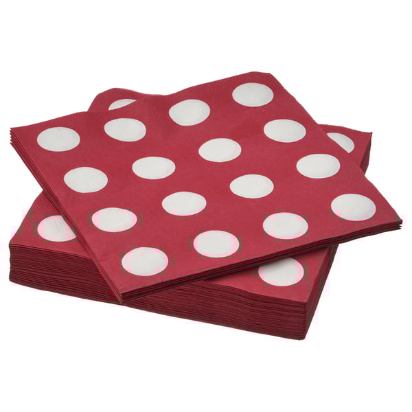 Stack of maroon, white-dotted, square-folded paper napkins.