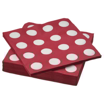 Stack of maroon, white-dotted, square-folded paper napkins.