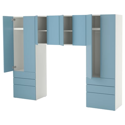 A light blue and white SMÅSTAD wardrobe unit with open doors and drawers, featuring a modern design and soft-close hinges.
