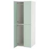 An ikea SMÅSTAD wardrobe. Its tall, white with light green doors, featuring soft-close hinges and adjustable shelves.