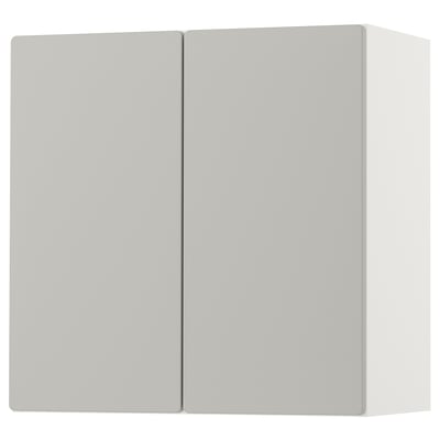 A white SMÅSTAD wall cabinet with two closed doors. The cabinet is rectangular and made of recycled materials. It has a sleek, modern design.