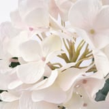 Beautiful artificial flowers clustered together, showcasing delicate petals and realistic texture.