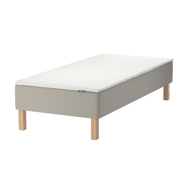 Ikeas gray SNARUM bed with light wood legs, made of cotton, polyester, wood, and foam.