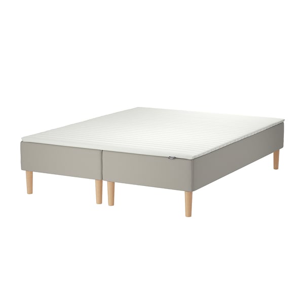 Ikeas SNARUM bed: rectangular, light gray, fabric-covered base with wooden legs.