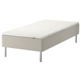 Ikea SNARUM bed: white, upholstered, rectangular, four metal legs.