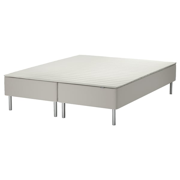 A white SNARUM bed base with a sprung mattress and metal legs. Its rectangular and designed for comfort.